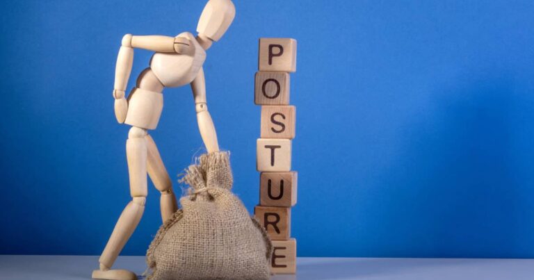 A small wooden mannequin and burlap sack in front of a block tower that says “posture” and a blue background.